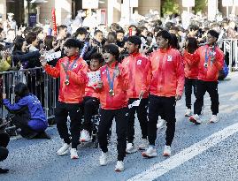 Japan's Paris Olympians, Paralympians parade in Tokyo