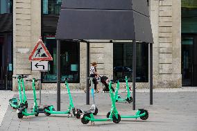 Rental E-scooters Parked In A Pedestrian Zone In Hamburg