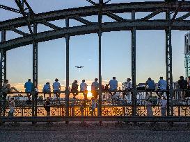 Young People Enjoying The Sunset At Hackerbruecke, Munich