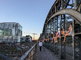 Young People Enjoying The Sunset At Hackerbruecke, Munich