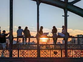 Young People Enjoying The Sunset At Hackerbruecke, Munich