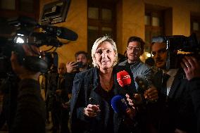 Marine Le Pen speaks to the press after the motions of censure at the National Assembly in Paris FA