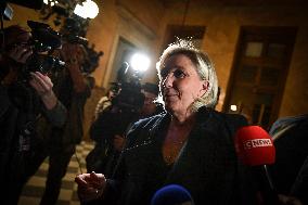 Marine Le Pen speaks to the press after the motions of censure at the National Assembly in Paris FA