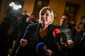 Marine Le Pen speaks to the press after the motions of censure at the National Assembly in Paris FA