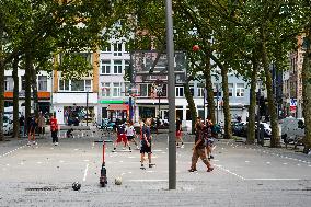 Youngsters Enjoy Basketball In A Antwerp Urban Playground