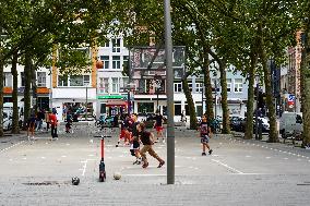 Youngsters Enjoy Basketball In A Antwerp Urban Playground