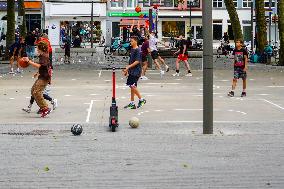 Youngsters Enjoy Basketball In A Antwerp Urban Playground