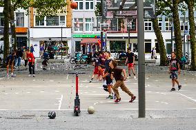 Youngsters Enjoy Basketball In A Antwerp Urban Playground