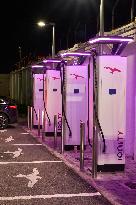 Electric Vehicle Charging Station At Night