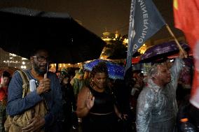 Demonstrators Shout Slogans As They Take Part In A Protest