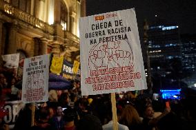 Demonstrators Shout Slogans As They Take Part In A Protest