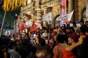 Demonstrators Shout Slogans As They Take Part In A Protest