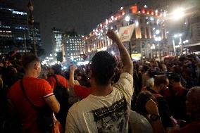 Demonstrators Shout Slogans As They Take Part In A Protest