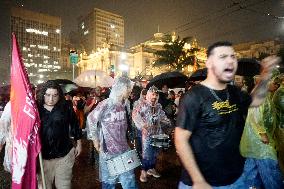 Demonstrators Shout Slogans As They Take Part In A Protest