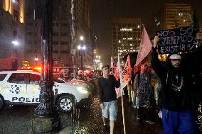 Demonstrators Shout Slogans As They Take Part In A Protest