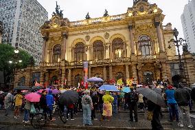 Demonstrators Shout Slogans As They Take Part In A Protest