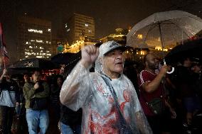 Demonstrators Shout Slogans As They Take Part In A Protest