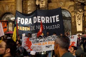 Demonstrators Shout Slogans As They Take Part In A Protest