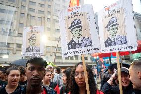 Demonstrators Shout Slogans As They Take Part In A Protest