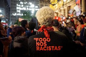 Demonstrators Shout Slogans As They Take Part In A Protest