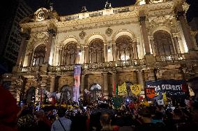 Demonstrators Shout Slogans As They Take Part In A Protest