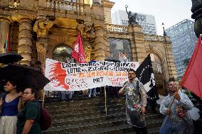 Demonstrators Shout Slogans As They Take Part In A Protest