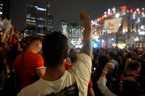 Demonstrators Shout Slogans As They Take Part In A Protest