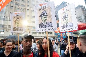 Demonstrators Shout Slogans As They Take Part In A Protest