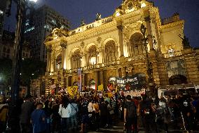 Demonstrators Shout Slogans As They Take Part In A Protest