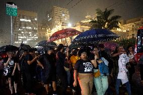 Demonstrators Shout Slogans As They Take Part In A Protest