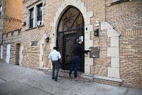 NYPD Investigators Inside Of 1479 Macombs Rd. In Mount Eden Section Of Bronx New York Following Stabbing Death Of A Woman And Ma