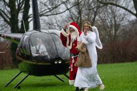 Santa Claus Comes With Hilicopter In Essen Steele