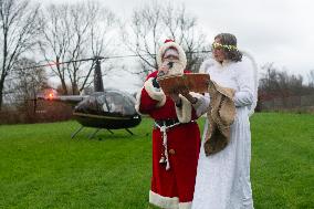 Santa Claus Comes With Hilicopter In Essen Steele