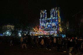 A Light Show Projected On The Facade Of Notre-Dame Cathedral - Paris