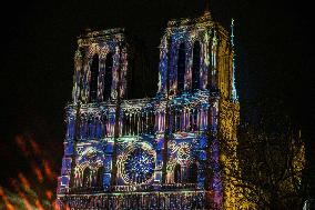 A Light Show Projected On The Facade Of Notre-Dame Cathedral - Paris