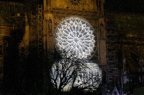 A Light Show Projected On The Facade Of Notre-Dame Cathedral - Paris