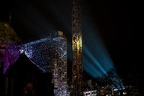 A Light Show Projected On The Facade Of Notre-Dame Cathedral - Paris