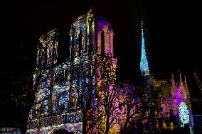 A Light Show Projected On The Facade Of Notre-Dame Cathedral - Paris