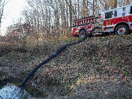 Washington DC Fire Fighters Battle A Brush Fire In Rock Creek Park In The Middle Of The City On December 7, 2024.