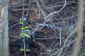 Washington DC Fire Fighters Battle A Brush Fire In Rock Creek Park In The Middle Of The City On December 7, 2024.