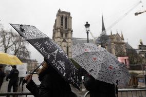 People attend the first mass outside Notre Dame Cathedral - Paris