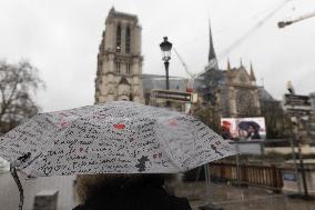 People attend the first mass outside Notre Dame Cathedral - Paris