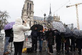 People attend the first mass outside Notre Dame Cathedral - Paris