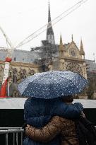 People attend the first mass outside Notre Dame Cathedral - Paris