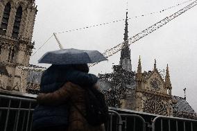 People attend the first mass outside Notre Dame Cathedral - Paris