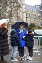 People attend the first mass outside Notre Dame Cathedral - Paris