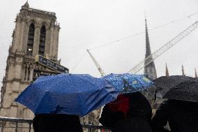 People attend the first mass outside Notre Dame Cathedral - Paris