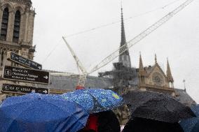 People attend the first mass outside Notre Dame Cathedral - Paris