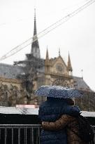 People attend the first mass outside Notre Dame Cathedral - Paris