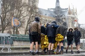 People attend the first mass outside Notre Dame Cathedral - Paris